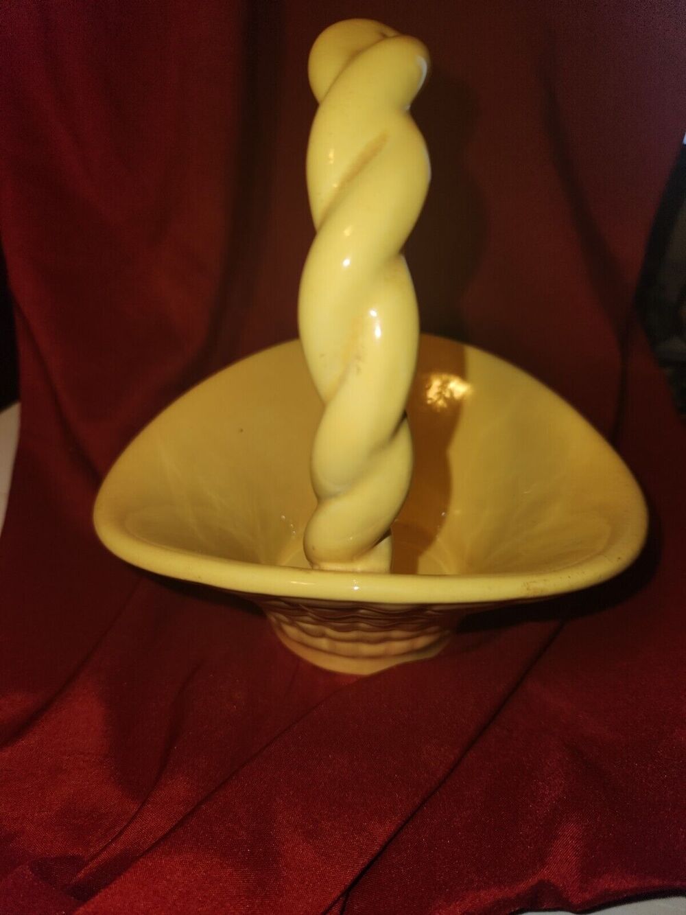 yellow ceramic basket has Leitsch on bottom